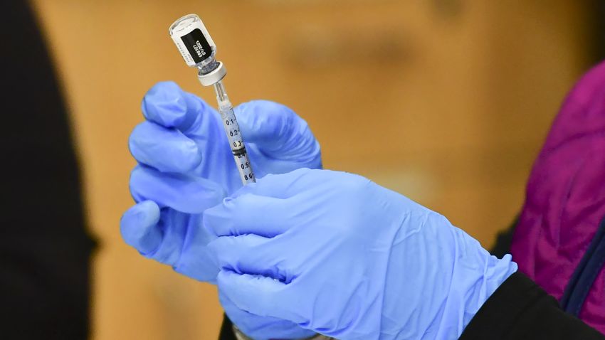 Registered Nurse Morgan James loads a syringe with a dose of the Pfizer Covid-19 vaccine at the Blood Bank of Alaska in Anchorage on March 19, 2021. - Alaska became the first state in the country last week to open vaccination access to everyone over the age of 16 and has fully vaccinated 16 percent of the state's population, the highest rate in the country. (Photo by Frederic J. BROWN / AFP) (Photo by FREDERIC J. BROWN/AFP via Getty Images)