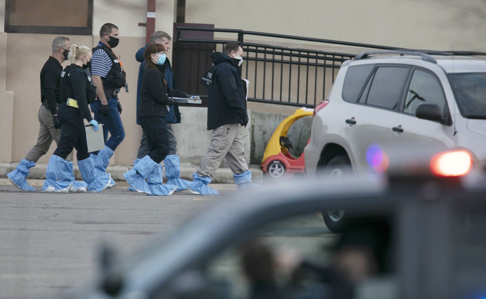 Police work outside the grocery store.