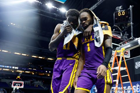 LSU players Josh LeBlanc Sr., left, and Javonte Smart walk off the court after their second-round loss to Michigan.
