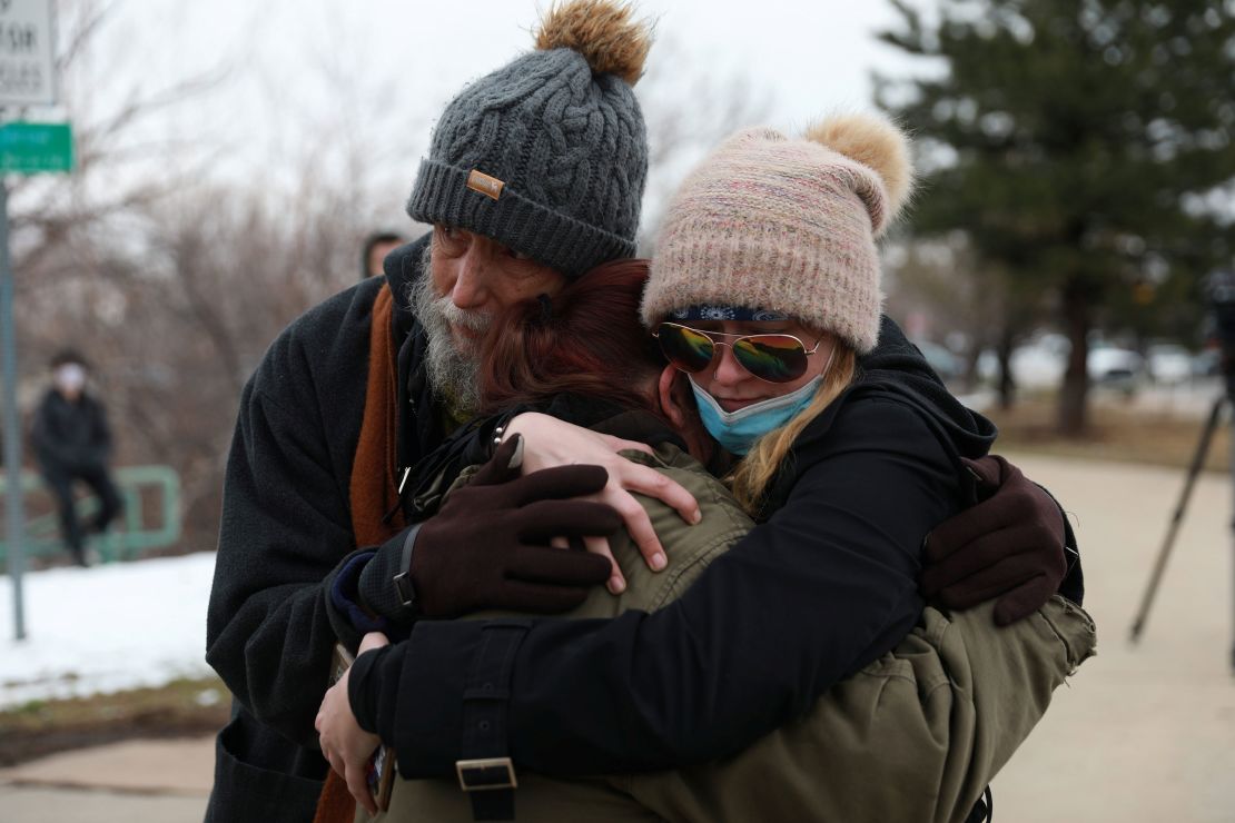 Sarah Moonshadow is comforted by David and Maggie Talley after Moonshadow was inside King Soopers grocery store.