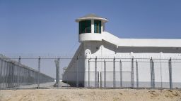This photo taken on May 31, 2019 shows a watchtower on a high-security facility near what is believed to be a re-education camp where mostly Muslim ethnic minorities are detained, on the outskirts of Hotan, in China's northwestern Xinjiang region. - As many as one million ethnic Uighurs and other mostly Muslim minorities are believed to be held in a network of internment camps in Xinjiang, but China has not given any figures and describes the facilities as "vocational education centres" aimed at steering people away from extremism. (Photo by GREG BAKER / AFP) / TO GO WITH AFP STORY CHINA-XINJIANG-MEDIA-RIGHTS-PRESS,FOCUS BY EVA XIAO        (Photo credit should read GREG BAKER/AFP via Getty Images)