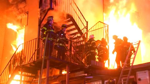 Firefighters battle flames Tuesday at a senior home in Spring Valley, New York.
