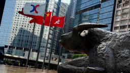 HONG KONG, CHINA - FEBRUARY 16: The Chinese and Hong Kong flags flutter outside the Exchange Square complex, which houses the Hong Kong Stock Exchange (HKEX), on February 16, 2021 in Hong Kong, China. (Photo by Zhang Wei/China News Service via Getty Images)