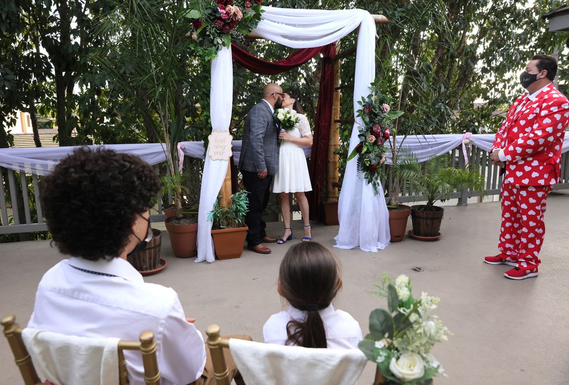 A couple getting married at an outdoor wedding on Valentine's Day, 2021 in long Beach, California.