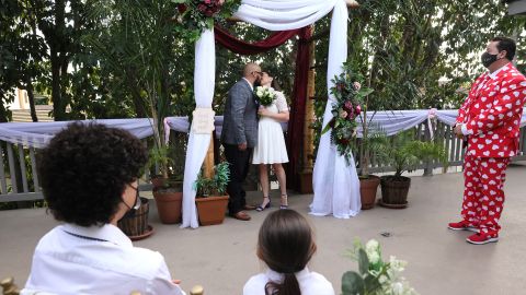 A couple getting married at an outdoor wedding on Valentine's Day, 2021 in long Beach, California.