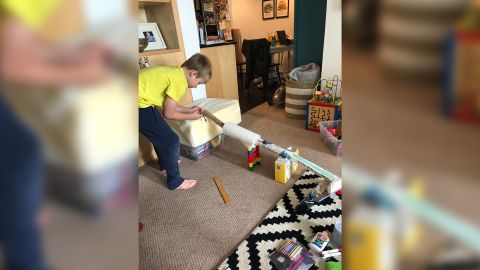 Alicia Carrithers' son Gavin, 10, creating a marble run for a school project at home.