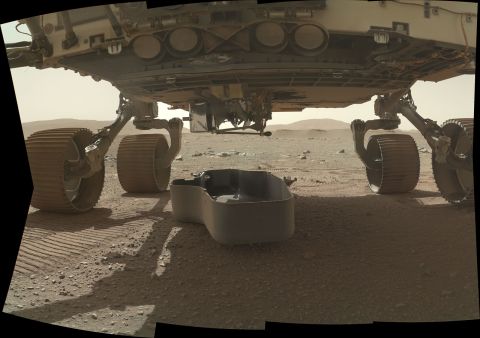 This image shows a debris shield, which protected the Ingenuity helicopter during landing. The helicopter can still be seen attached underneath the rover.