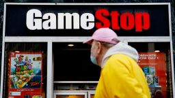 A man looks at GameStop at 6th Avenue on February 25, 2021 in New York. GameStop Corp. doubled its shares and and jumped another 19 percent today and the betting are that GameStop shares would spike to $800 on Friday. (Photo by John Smith/VIEWpress via Getty Images)
