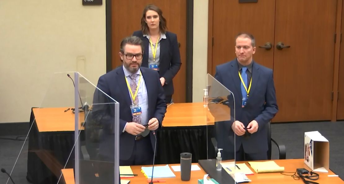 In this image taken from video, defense attorney Eric Nelson, left, former Minneapolis police officer Derek Chauvin, right, and Nelson's assistant Amy Voss, back, introduce themselves to jurors on Monday, March 22, 2021, at the Hennepin County Courthouse in Minneapolis.