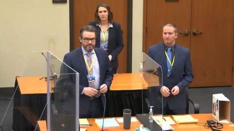 In this image taken from video, defense attorney Eric Nelson, left, former Minneapolis police officer Derek Chauvin, right, and Nelson's assistant Amy Voss, back, introduce themselves to jurors on Monday, March 22, 2021, at the Hennepin County Courthouse in Minneapolis.