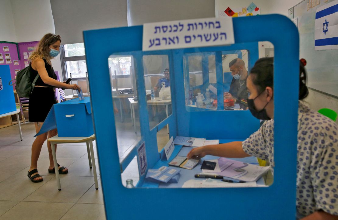 An Israeli voter casts her ballot at a polling station in Tel Aviv on Tuesday.