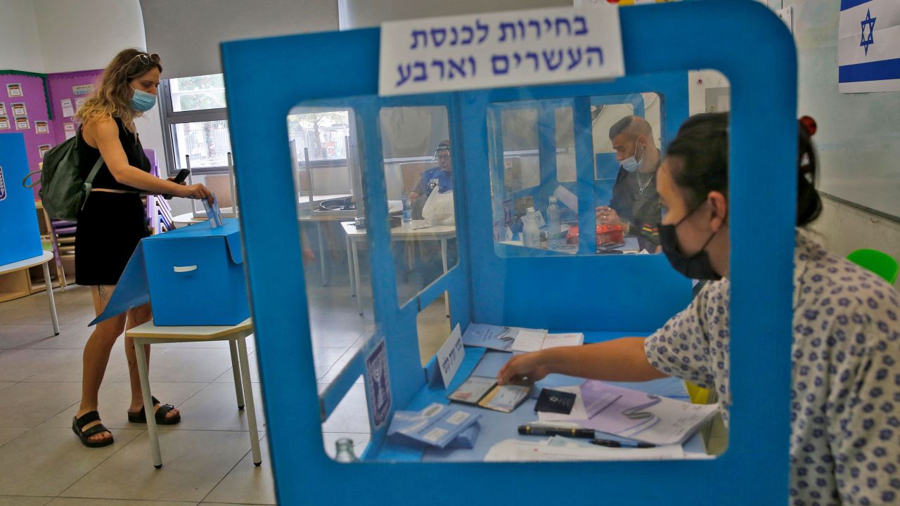 An Israeli voter casts her ballot at a polling station in Tel Aviv on Tuesday.