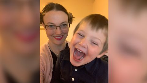 Nicole Coomber having a laugh with her son after teaching an online class.