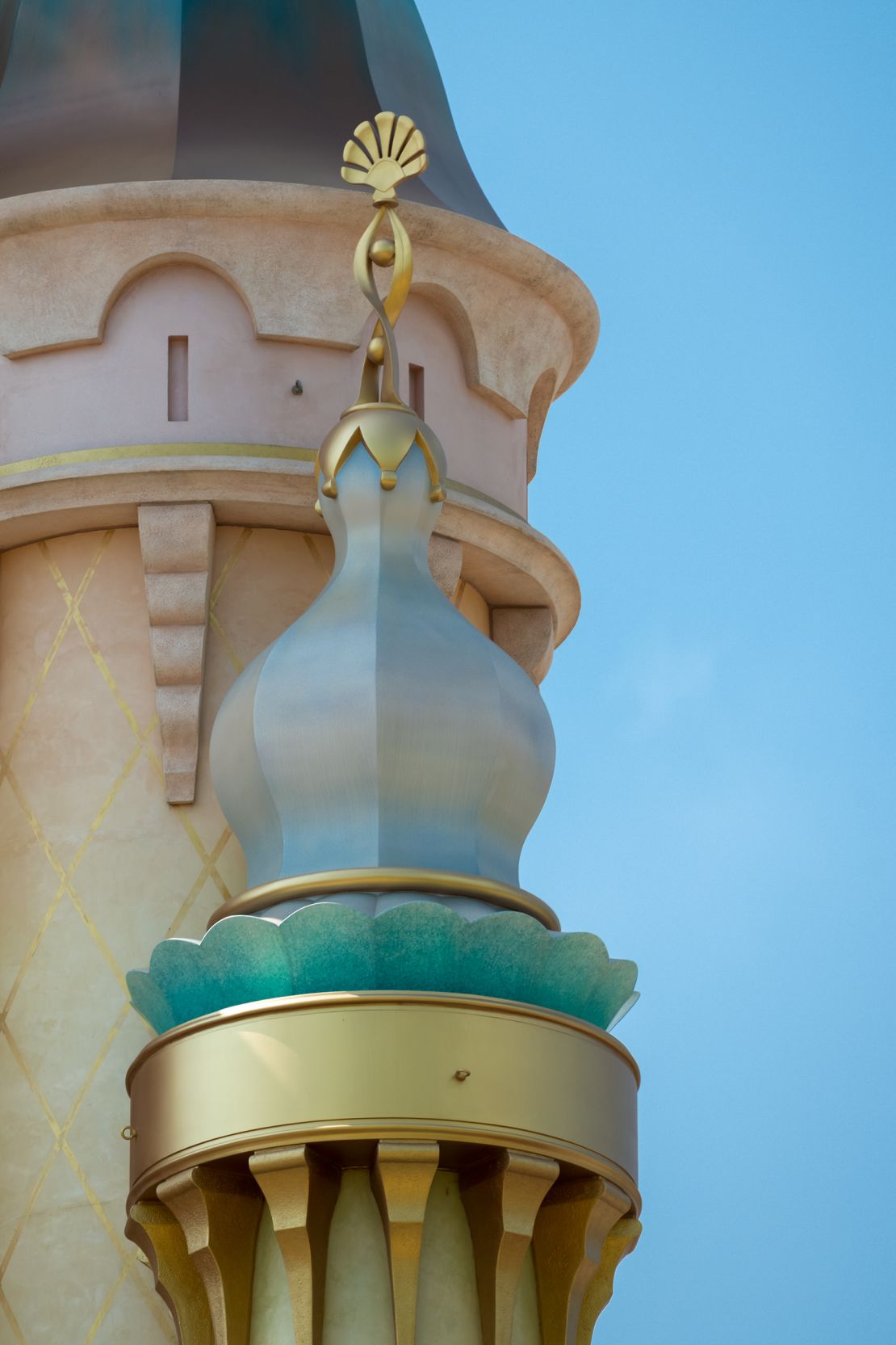 A gold seashell is the crowning feature atop Princess Ariel's tower.