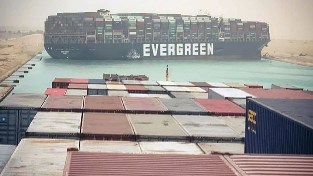 Mandatory Credit: Photo by STR/EPA-EFE/Shutterstock (11828499a)
The Suez Canal is blocked by a large container ship 'Ever Given' in the Suez Canal, Egypt, 24 March 2021 A large container ship registered in Panama ran aground in the Suez Canal on 23 March, blocking passage of other ships and causing a traffic jam for cargo vessels
Suez Canal blocked as container ship runs aground, Egypt - 24 Mar 2021