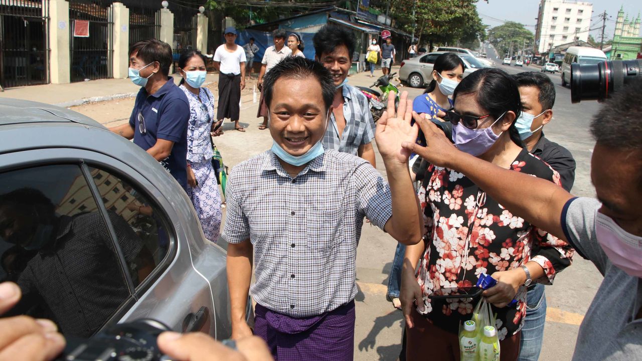 AP journalist Thein Zaw waves after his release from detention on Wednesday.