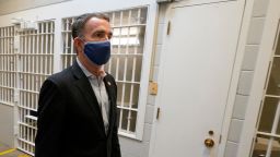 Gov. Ralph Northam walks past the holding cells next to the death chamber during a tour at the Greensville Correctional Center prior to signing a bill abolishing the state's death penalty in Jarratt, Va., Wednesday, March 24, 2021. 
