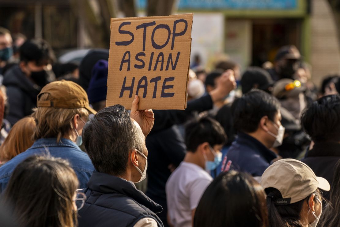 Demonstrators gather in the Chinatown-International District for a "We Are Not Silent" rally and march against anti-Asian hate and bias on March 13, 2021 in Seattle, Washington. (Photo by David Ryder/Getty Images)