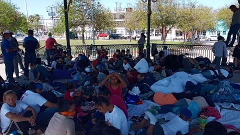 A gazebo in Reynosa, Mexico, is packed with migrants after authorities ordered them away from a bridge by the border.