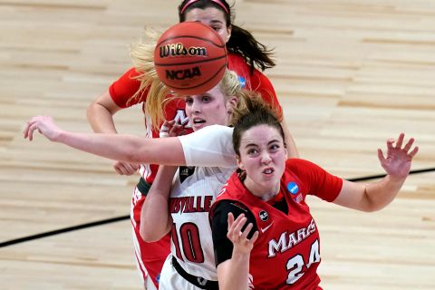 Marist guard Sarah Barcello, right, and Louisville guard Hailey Van Lith battle for a rebound on March 22.