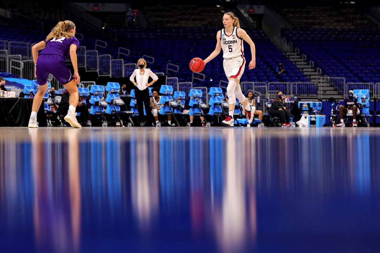 Connecticut point guard Paige Bueckers brings the ball up the court during a first-round game against High Point on March 21.