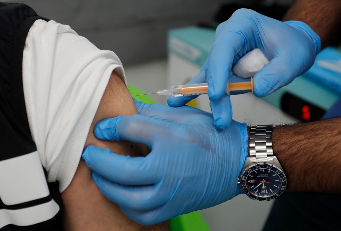 The AstraZeneca vaccine is given to a patient at a pharmacy in Edgware, London on March 16, 2021.