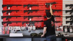 DELRAY BEACH, FLORIDA - MARCH 24: Brandon Wexler helps a customer look at weapons at WEX Gunworks on March 24, 2021 in Delray Beach, Florida. U.S. President Joe Biden has called on lawmakers to "immediately pass" legislation to help curb gun violence in the county. (Photo by Joe Raedle/Getty Images)