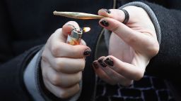 A recreational marijuana smoker holds a joint in Brooklyn, New York, in April 2020.
