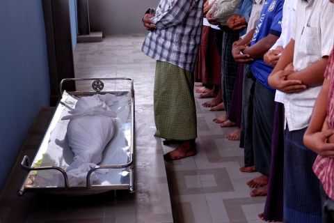 Men pray during the funeral of Khin Myo Chit, a 7-year-old girl <a href="https://www.cnn.com/2021/03/24/asia/myanmar-protests-7-year-old-killed-intl-hnk/index.html" target="_blank">who was shot in her home</a> by Myanmar's security forces on March 23. The girl was killed during a military raid, according to the Reuters news agency and the advocacy group Assistance Association for Political Prisoners.