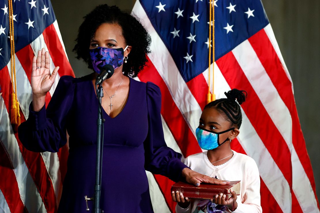 Kim Janey is sworn in as the mayor of Boston next to her granddaughter Rosie Janey, at Boston City Hall on March 24, 2021 in Boston