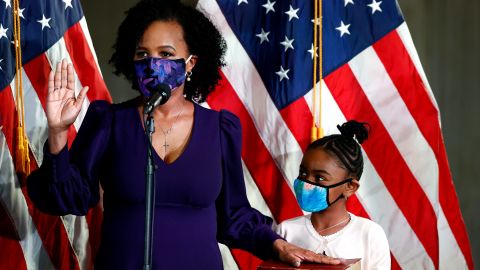 Kim Janey is sworn in as the mayor of Boston next to her granddaughter Rosie Janey, at Boston City Hall on March 24, 2021 in Boston