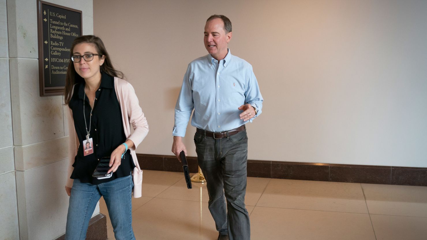 House Intelligence Chairman Adam Schiff, D-Calif., joined by Communications Director Emilie Simons, left, walks to a secure facility in the Capitol to prepare for depositions in the impeachment inquiry of then-President Donald Trump. 