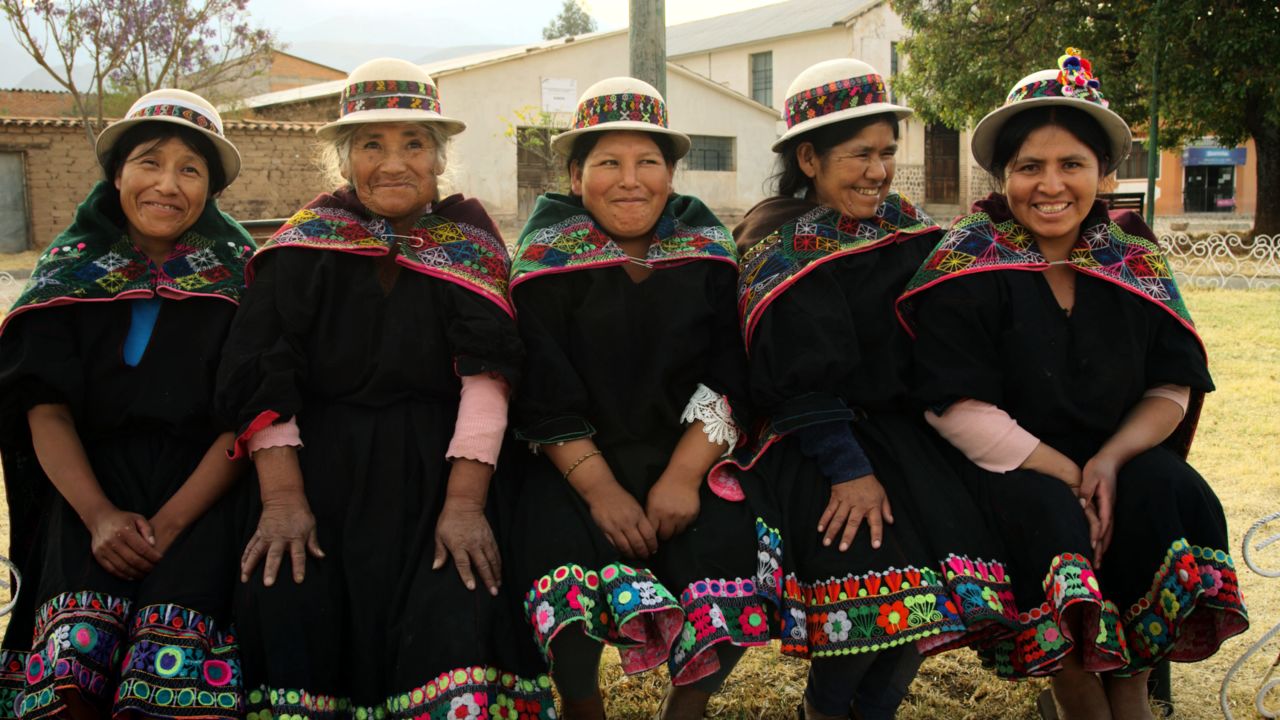 Andean women are shown in traditional dress in a scene from "Magical Andes: Season 2" on Netflix.