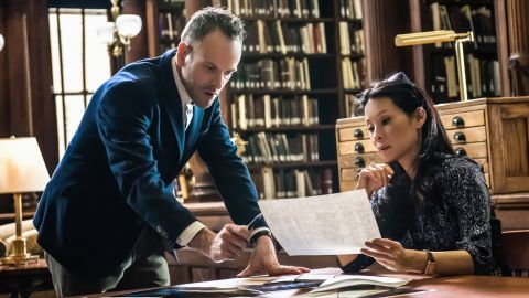 Holmes (Jonny Lee Miller) and Watson (Lucy Liu) looking for clues.