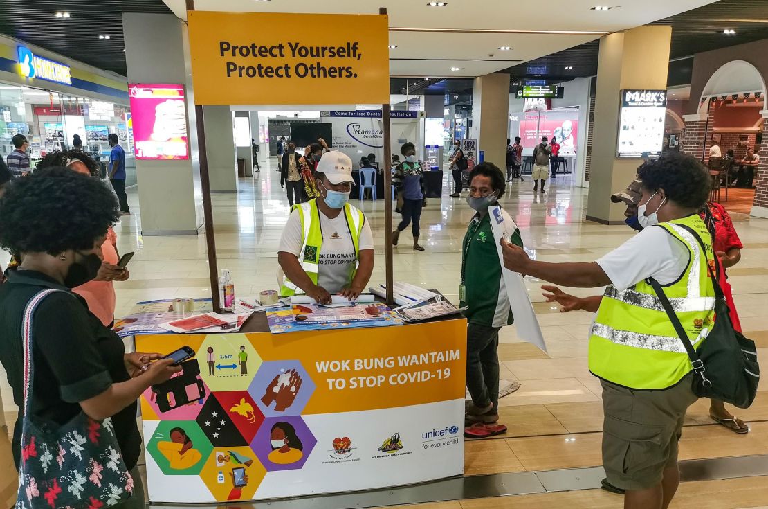 People learn how to prevent Covid-19 at a shopping center in the capital Port Moresby on September 4, 2020.