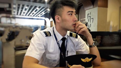 Flight attendant Chai Cheng dressed in his uniform, in an undated photograph before he lost his job at China Southern Airlines.