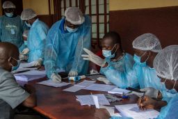 Health workers from the Guinean Ministry of Health prepare forms to register medical staff ahead of their anti-ebola vaccines at the N'zerekore Hospital.