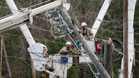 Crews work to restore power in Wellington, Alabama, on Friday. About 38,000 homes and businesses were without power in Alabama and Georgia on Friday morning, according to utility tracker PowerOutage.us.