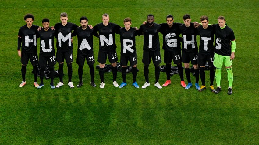 DUISBURG, GERMANY - MARCH 25: Players of Germany wear t-shirts which spell out "Human Rights" prior to the FIFA World Cup 2022 Qatar qualifying match between Germany and Iceland on March 25, 2021 in Duisburg, Germany. Sporting stadiums around Germany remain under strict restrictions due to the Coronavirus Pandemic as Government social distancing laws prohibit fans inside venues resulting in games being played behind closed doors. (Photo by Tobias Schwarz - Pool/Getty Images)