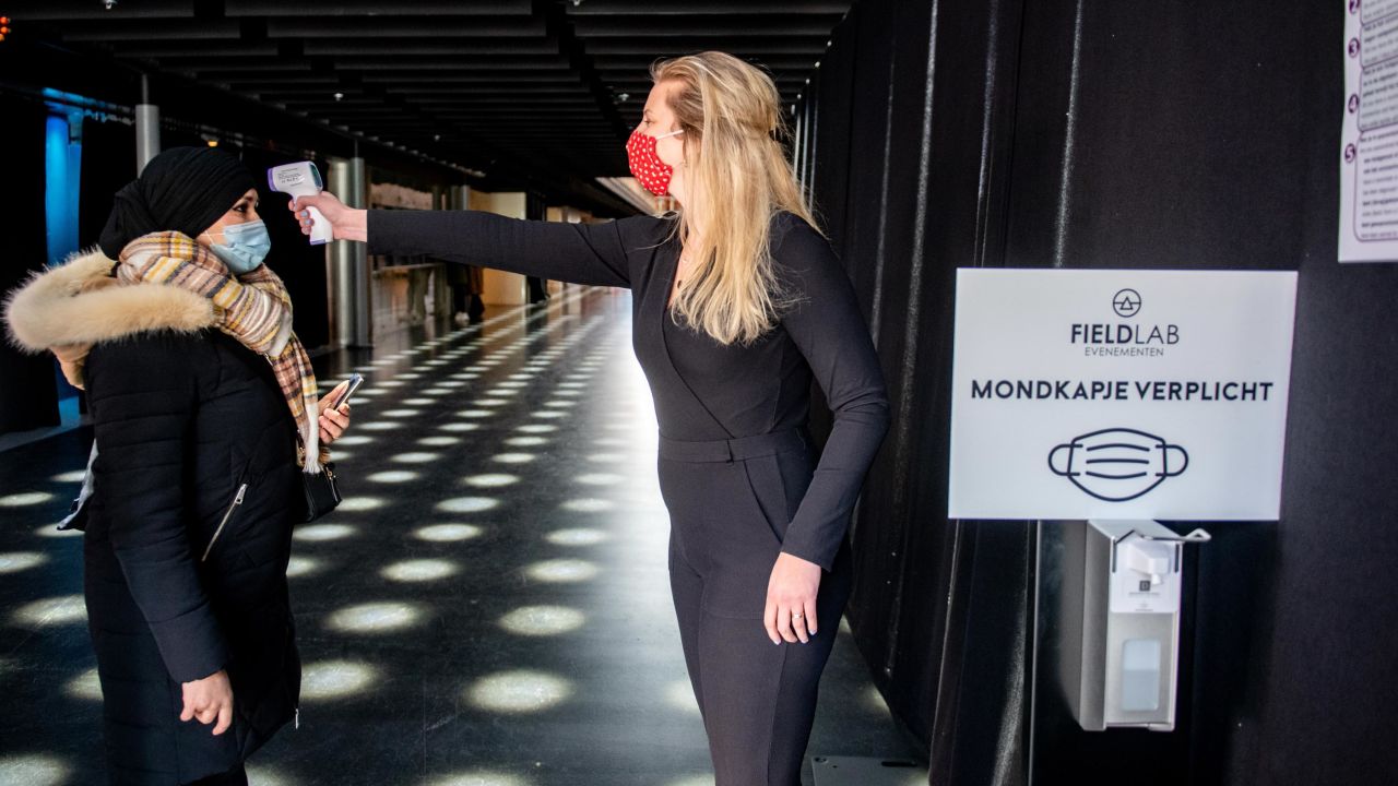 A visitor has their temperature measured before entering The Ziggo Dome in Amsterdam on March 6 2021.