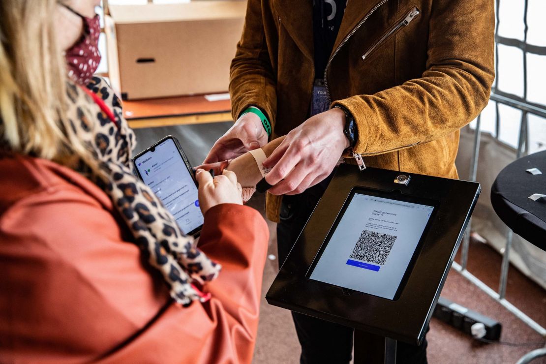 Visitors have their QR code scanned to attend the "Back To Live" pop festival at Walibi Holland in Biddinghuizen, northern Netherlands.