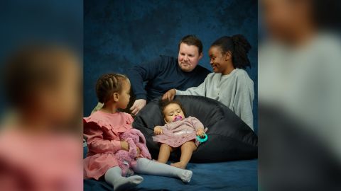 Frank Lundt, his wife, Mary Mithika, and their daughters, Ayah, 1, (seated) and Amira, 2.
