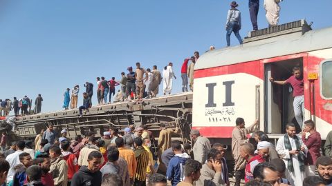 The damaged train cars after the passenger trains collided near Tahta.