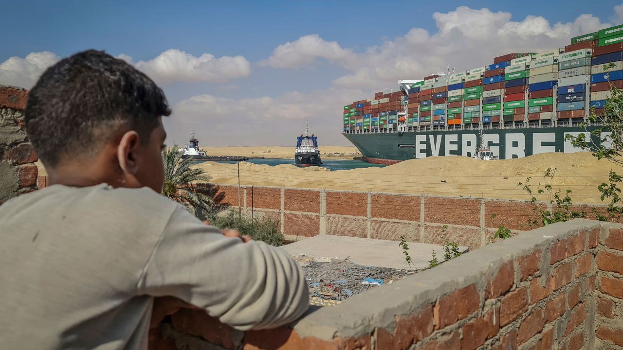 A boy observes two tugboats taking part in the refloating operation over the weekend.