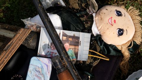 A photo is seen on a pile of items salvaged from a home in Ohatchee.