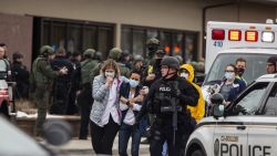 BOULDER, CO - MARCH 22: Healthcare workers walk out of a King Sooper's Grocery store after a gunman opened fire on March 22, 2021 in Boulder, Colorado. Dozens of police responded to the afternoon shooting in which at least one witness described three people who appeared to be wounded, according to published reports.  (Photo by Chet Strange/Getty Images))
