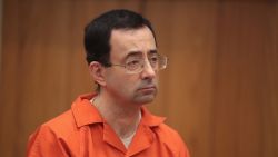 CHARLOTTE, MI - FEBRUARY 05:  Larry Nassar stands as he is sentenced by Judge Janice Cunningham for three counts of criminal sexual assault in Eaton County Circuit Court on February 5, 2018 in Charlotte, Michigan. Nassar has been accused of sexually assaulting more than 150 girls and young women while he was a physician for USA Gymnastics and Michigan State University. Cunningham sentenced Nassar to 40 to 125 years in prison. He is currently serving a 60-year sentence in federal prison for possession of child pornography. Last month a judge in Ingham County, Michigan sentenced Nassar to an 40 to 175 years in prison after he plead guilty to sexually assaulting seven girls.  (Photo by Scott Olson/Getty Images)