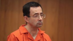 CHARLOTTE, MI - FEBRUARY 05:  Larry Nassar stands as he is sentenced by Judge Janice Cunningham for three counts of criminal sexual assault in Eaton County Circuit Court on February 5, 2018 in Charlotte, Michigan. Nassar has been accused of sexually assaulting more than 150 girls and young women while he was a physician for USA Gymnastics and Michigan State University. Cunningham sentenced Nassar to 40 to 125 years in prison. He is currently serving a 60-year sentence in federal prison for possession of child pornography. Last month a judge in Ingham County, Michigan sentenced Nassar to an 40 to 175 years in prison after he plead guilty to sexually assaulting seven girls.  (Photo by Scott Olson/Getty Images)