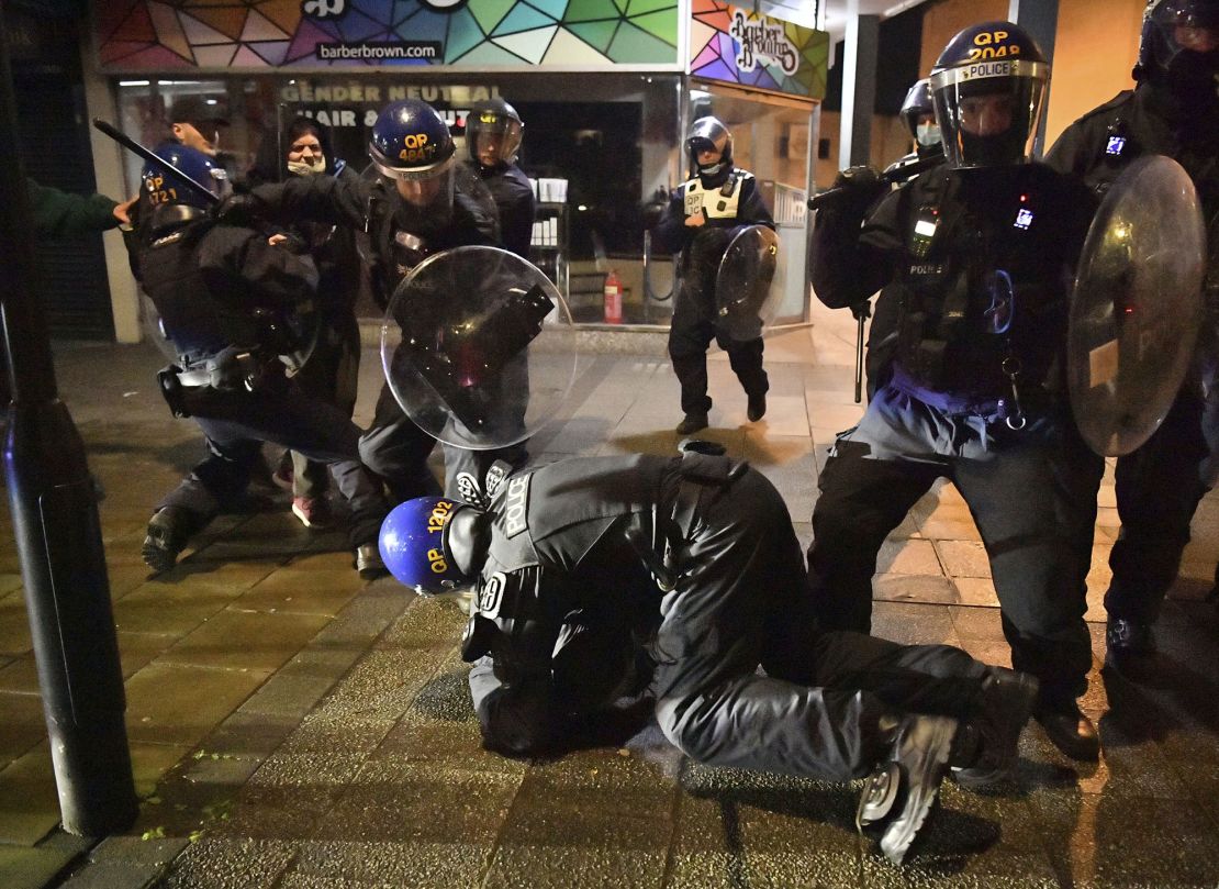 Police officers detain a man as they move in on demonstrators during the "Kill The Bill" protest in Bristol.