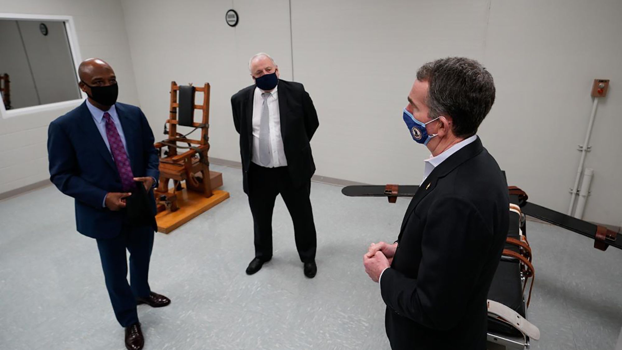 Gov. Ralph Northam, right, tours Greensville Correctional Center in Jarratt, Virginia, on March 24, 2021.